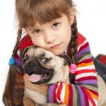 child with pug